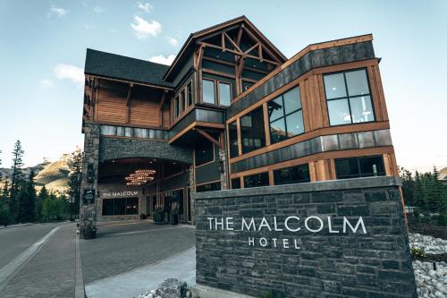 a building with a sign that reads the malcolm hotel at The Malcolm Hotel in Canmore