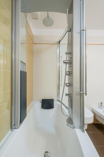 a bathroom with a shower and a sink at Petroni 38 by Studio Vita in Bologna