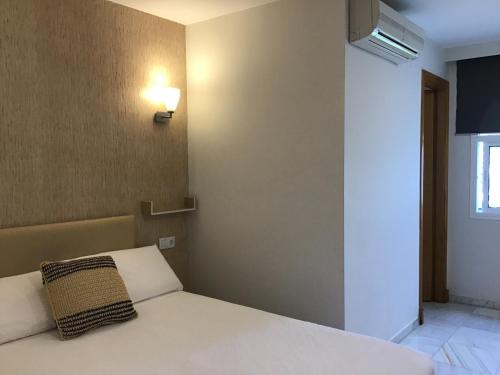 Postel nebo postele na pokoji v ubytování Hotel Nómadas
