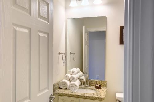 a bathroom with a sink and a mirror at Waterside Resort by Capital Vacations in Edenton
