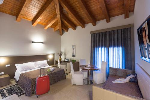 Ένα ή περισσότερα κρεβάτια σε δωμάτιο στο Casale Santa Maria Country House