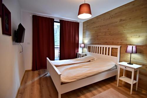 Кровать или кровати в номере Borov park 3