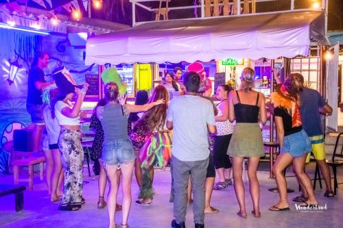a group of people dancing at a party at Wonderland by GB Collection in Cartagena de Indias