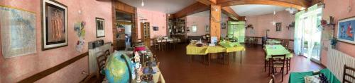 a room with two tables and chairs in a building at B&B Scacco Matto in Popiglio