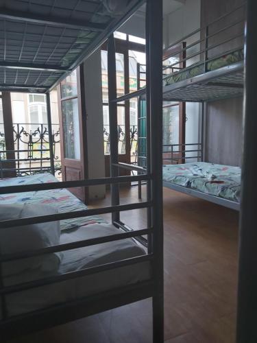 A bunk bed or bunk beds in a room at Porto Downtown Hostel