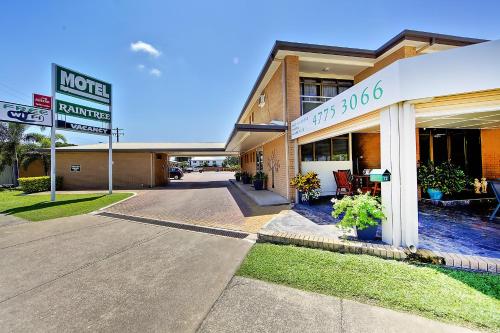 a store front of a building with a sign at Raintree Motel in Townsville