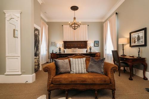 a living room with a couch with pillows on it at The Kendall in Boerne