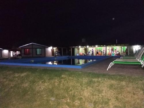 a building at night with a lot of lights at Cabañas Las Bahienses in San Rafael