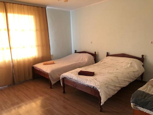 Ένα ή περισσότερα κρεβάτια σε δωμάτιο στο Guest House Agush