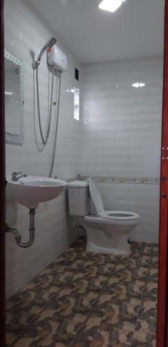 a bathroom with a toilet and a sink at Lucky 190 in Chau Doc