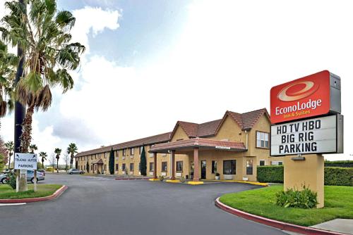 a hotel with a sign that reads hot tv hotel big rig parking at Econo Lodge Inn & Suites Corning Travel Center in Corning