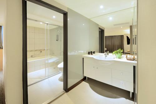 a bathroom with a toilet and a sink and a shower at Green Garden Apartments-A in Taipei