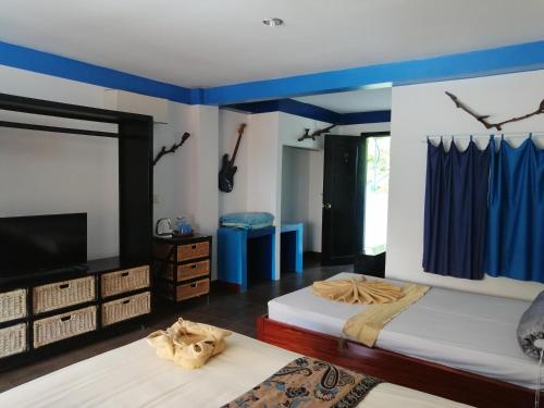 Cama o camas de una habitación en Hotel de la Plage