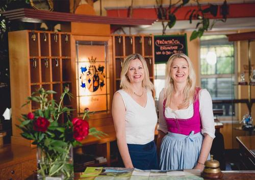 two women standing next to each other at a table at Landgasthof Gietl in Kammern im Liesingtal