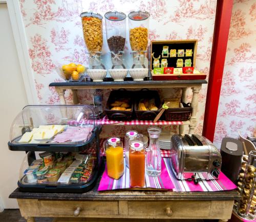 a buffet with food and drinks on a table at Regyn's Montmartre in Paris