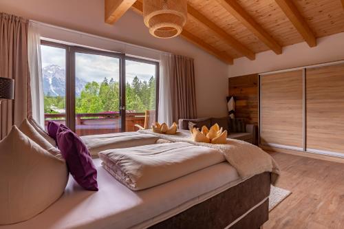 Postel nebo postele na pokoji v ubytování Hotel Alpennest