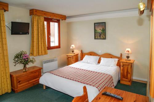 Postel nebo postele na pokoji v ubytování Odalys Chalet Alpina