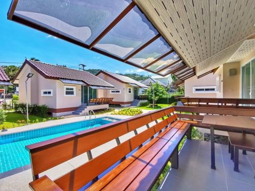 a view of a swimming pool from the balcony of a house at Diamond Pool Villa@Samui in Koh Samui 