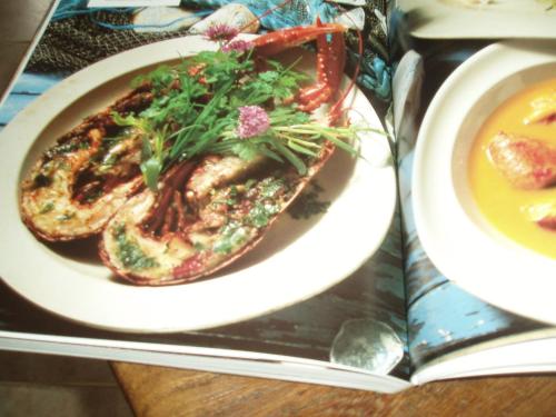 a plate of food with a sandwich and a bowl of soup at The Old Forge Seafood Restaurant and Bed and Breakfast in Thursford