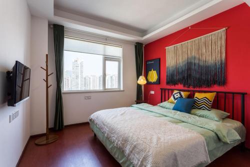 Krevet ili kreveti u jedinici u objektu Wuhan Jianghan·Hankou Railway Station· Locals Apartment 00120600