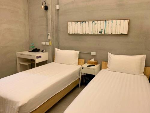 Een bed of bedden in een kamer bij Chia Kon Hotel
