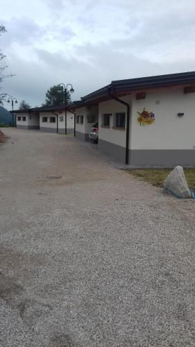 a row of buildings with a parking lot at Alice in Castello Tesino