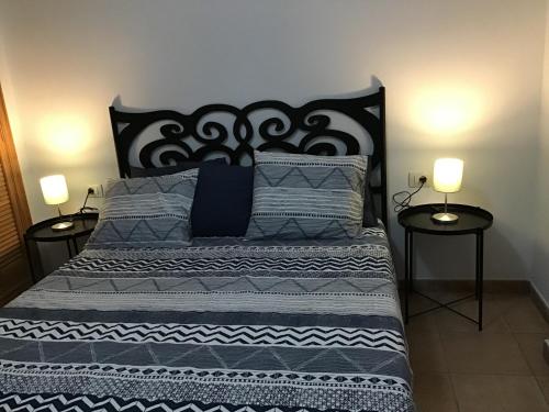 En eller flere senge i et værelse på Playa de Isora