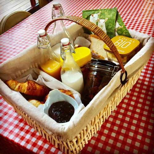 a basket of food sitting on a table at Le Cabanon de Chessy in Chessy