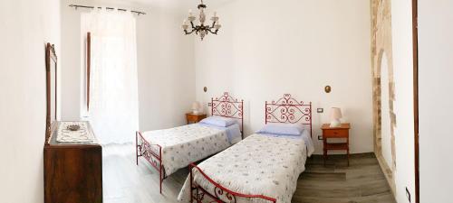 Postel nebo postele na pokoji v ubytování Palazzo Elisei