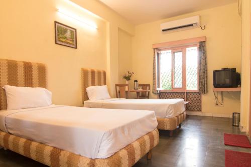 Ліжко або ліжка в номері Shanthiniketan - Ramoji Film City