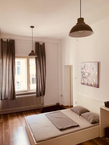 a bedroom with a bed and a window at Lovecroatia Zagreb - 'Pax nest' in Zagreb