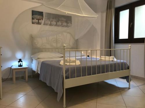 Posteľ alebo postele v izbe v ubytovaní Le Casuzze del Residence Lido Burrone