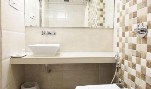 Koupelna v ubytování Hotel Aaram Orchard