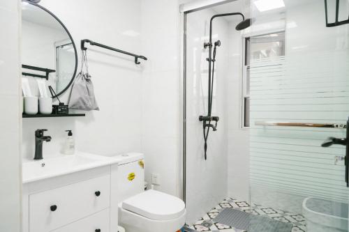 a bathroom with a shower and a toilet and a sink at [Passenger] Wuhan，Qiekou District, Liji North Road in Wuhan