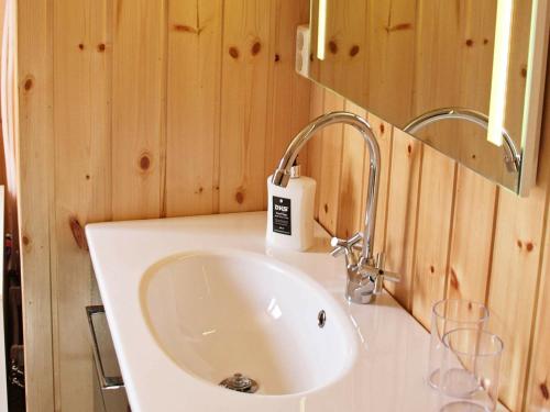 a bathroom with a sink and a mirror at One-Bedroom Holiday home in Gravdal in Gravdal