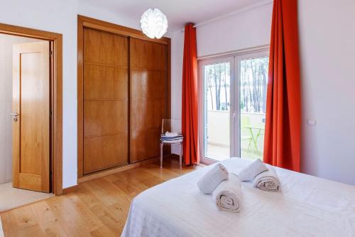 Postel nebo postele na pokoji v ubytování Villa Amendoa