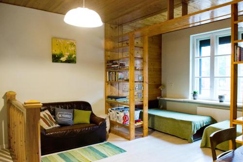 a living room with a bunk bed and a couch at Spacious Klaipeda Apartment EV in Klaipėda