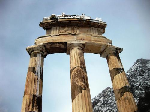 ancient columns with mountains in the background at Parnassos Delphi Hotel in Delfoi