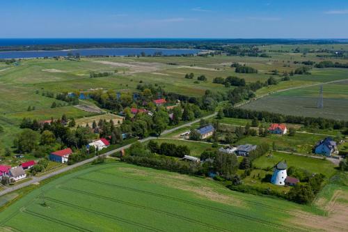 an aerial view of a small village in a green field at Windmill vacation home in Ledzin near Baltic Sea in Niechorze