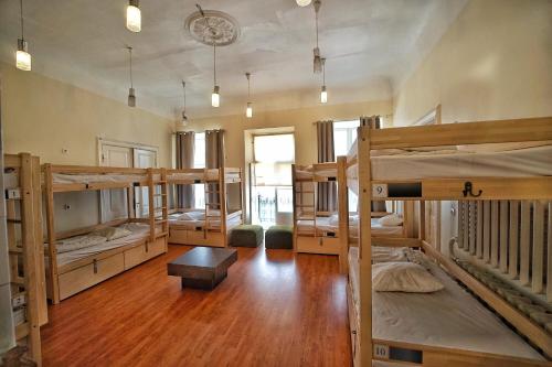 a room with a bunch of bunk beds at The Monks Bunk Hostel & Bar in Tallinn