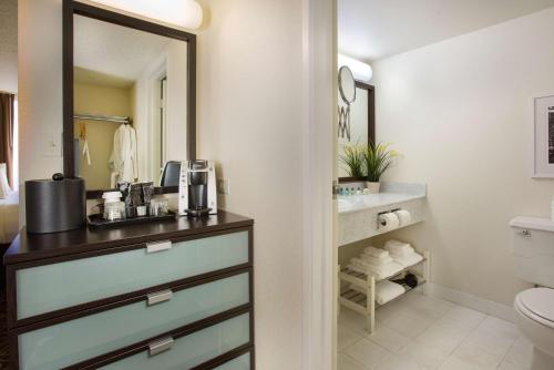 a bathroom with a sink and a toilet at Red Lion Inn & Suites Olympia, Governor Hotel in Olympia