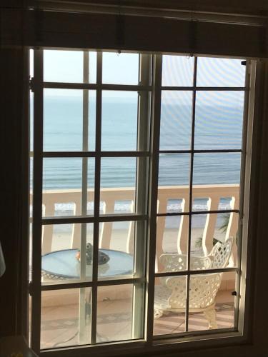 an open window with a view of the ocean at CafeGourmetPtaCorona in San Carlos