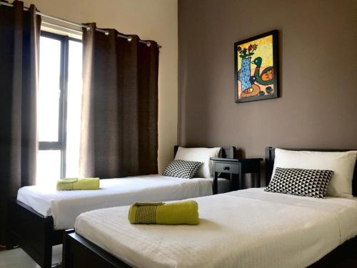 Postel nebo postele na pokoji v ubytování SG Residence by NYS - 2BR