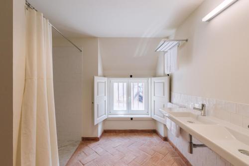 Postel nebo postele na pokoji v ubytování Travassos 11