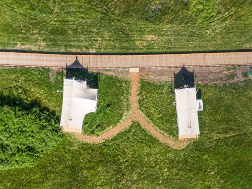an overhead view of two buildings in a field at Under Canvas West Yellowstone in West Yellowstone