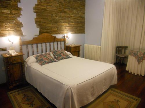 Postel nebo postele na pokoji v ubytování Hotel Taramundi