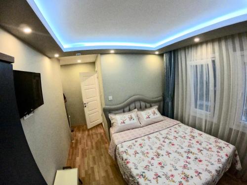 a bedroom with a bed and a blue light at PASHA APART~BOUTİQUE HOTEL/YALOVA in Yalova