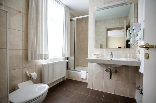 Koupelna v ubytování Parkhotel Lingen by Hackmann