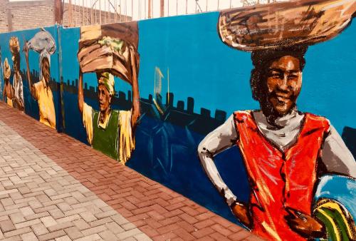 a painting of a woman with a hat on her head at Casa Sodadi in Praia