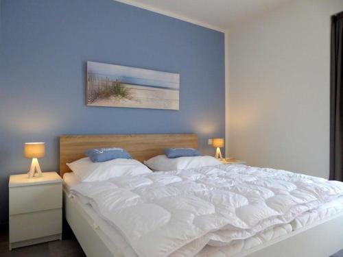 Postel nebo postele na pokoji v ubytování Apartment HEIMATHAFEN, Am Alten Deich 14/1